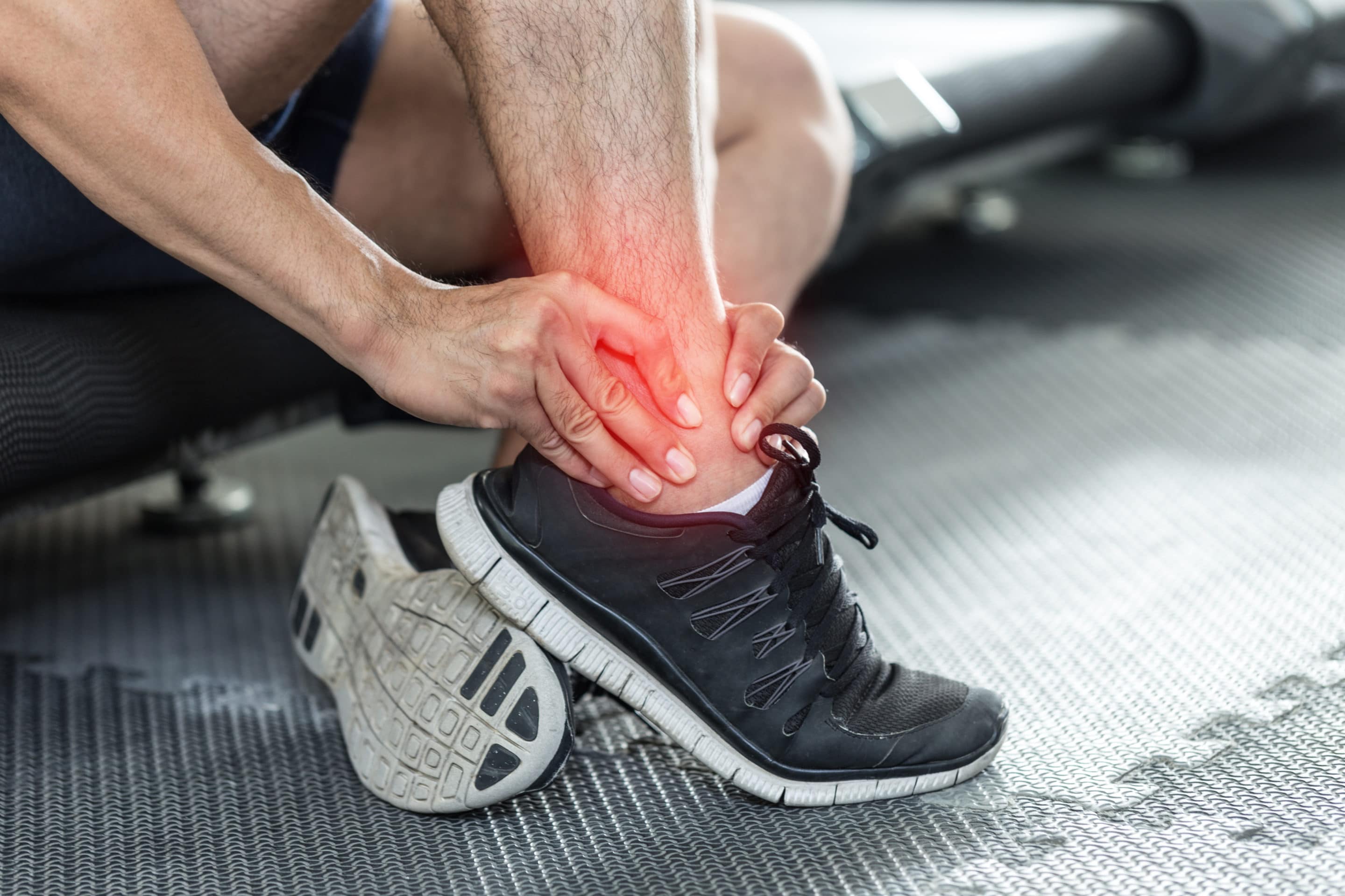 Asian man injury ankle pain after training running workout in gym feeling so pain,Healthcare Concept Asian man injury ankle pain after training running workout in gym feeling so pain,Healthcare Concept